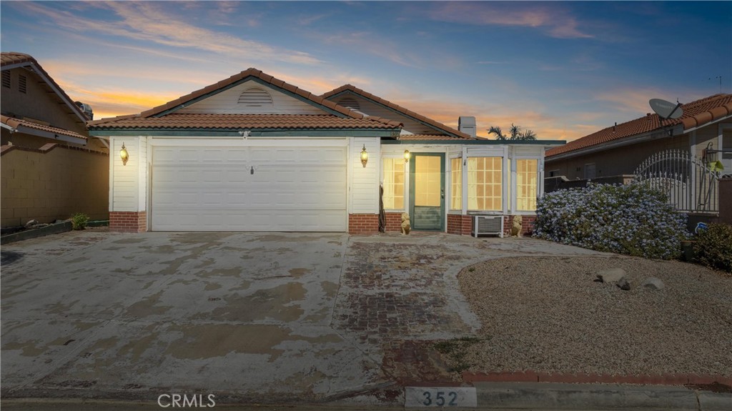 352 Red Spruce Place Perris, CA 92570 - Photo 25 of 30 a front view of a house with a yard