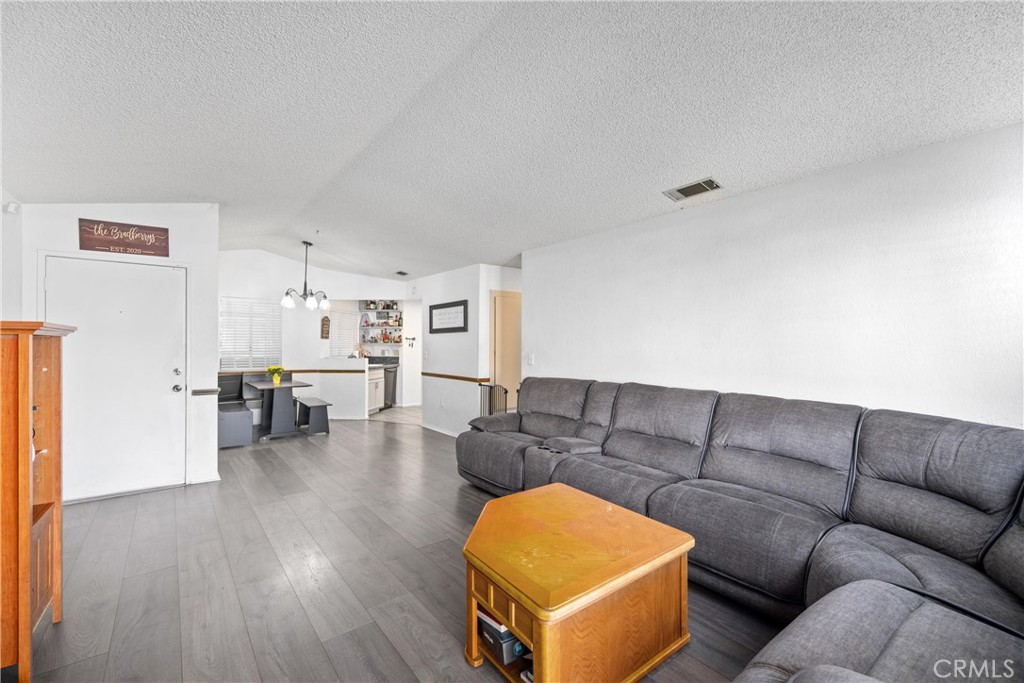 352 Red Spruce Place Perris, CA 92570 - Photo 10 of 30 a living room with furniture and a wooden floor