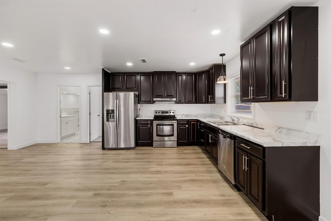 629 Little Meadow Drive Riverside, OH 45404 - Photo 15 of 48 This kitchen features sleek countertops and modern appliances, creating a functional cooking space.