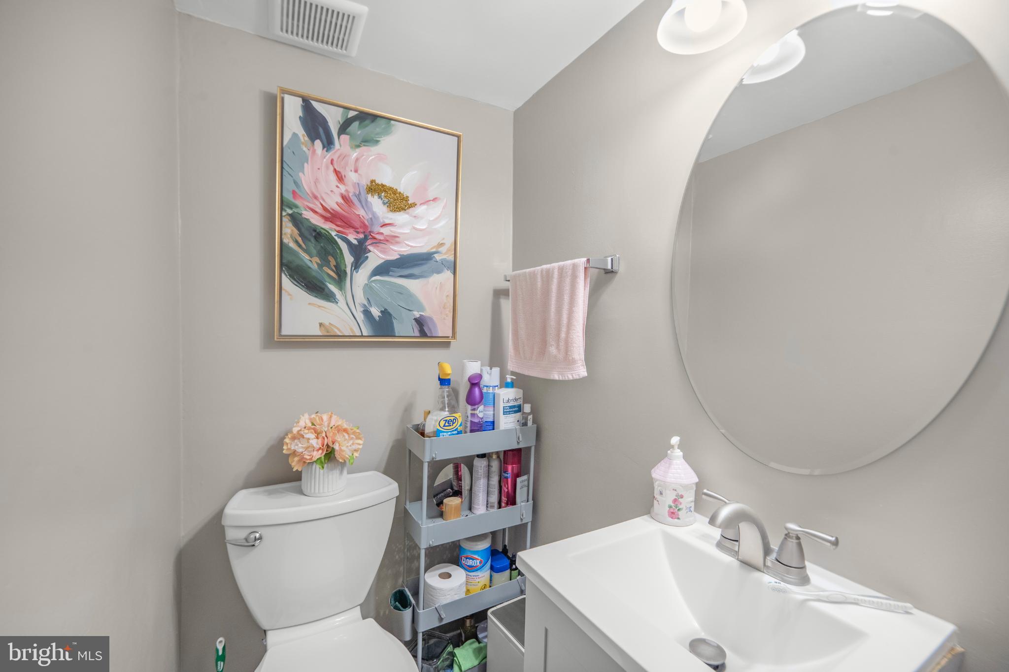 7617 Allendale Circle Landover, MD 20785 - Photo 12 of 26 a bathroom with a toilet sink and mirror