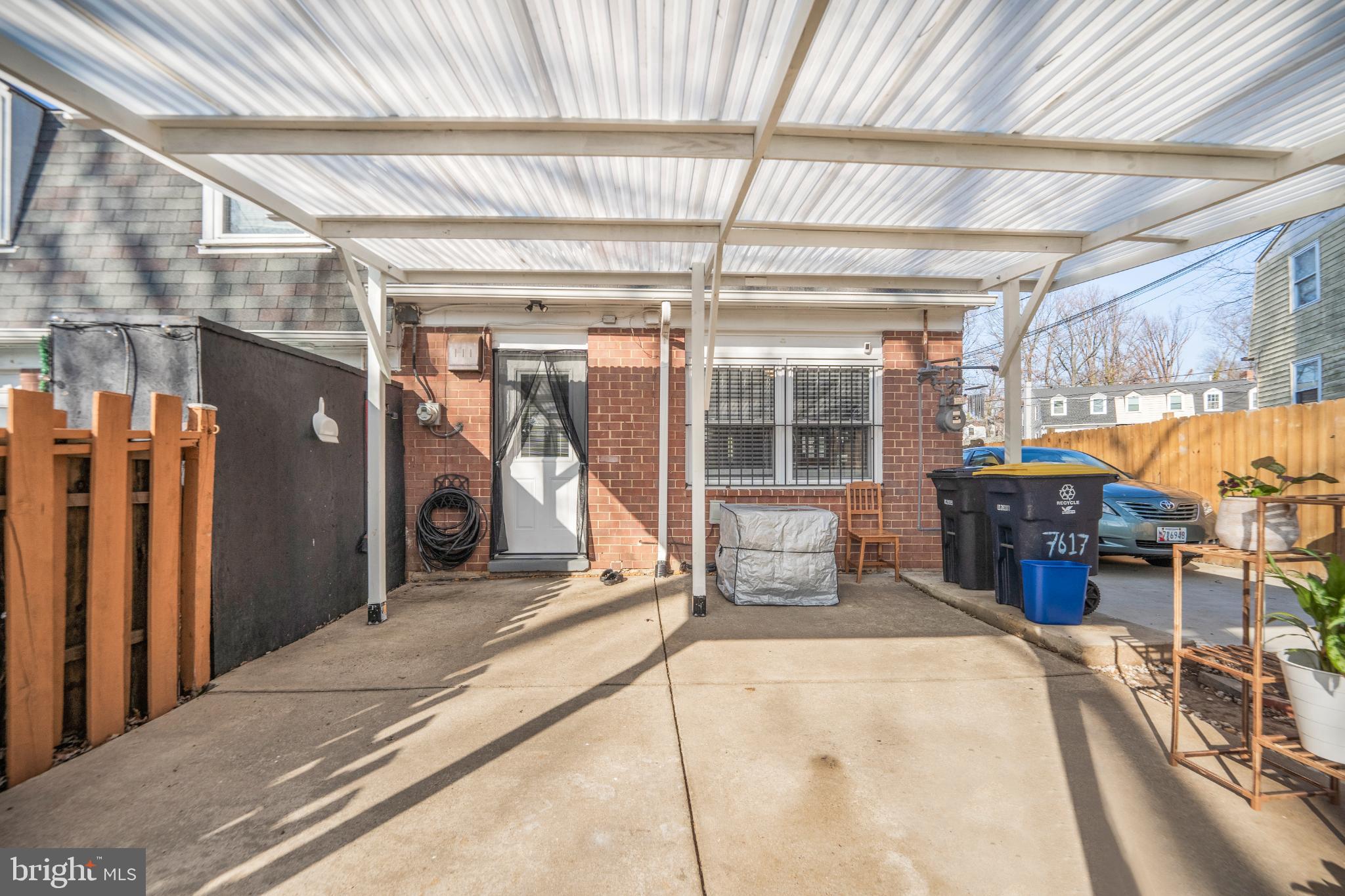 7617 Allendale Circle Landover, MD 20785 - Photo 23 of 26 a view of a porch with a table and chairs