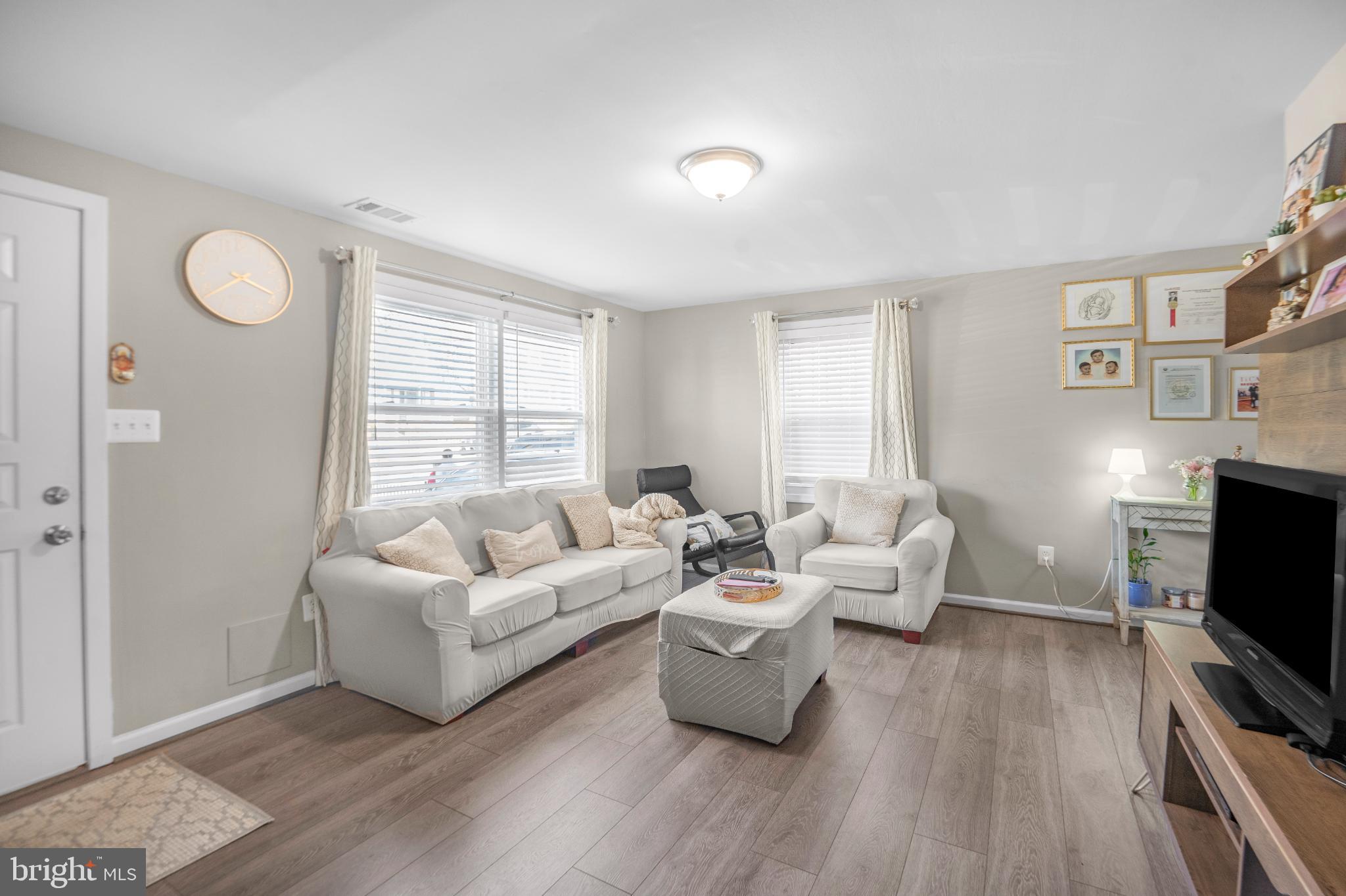 7617 Allendale Circle Landover, MD 20785 - Photo 6 of 26 a living room with furniture and a flat screen tv