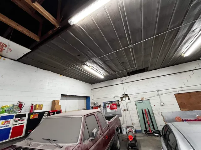 a storage & utility room with lots of wooden furniture