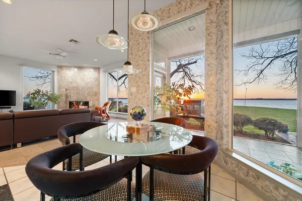 a bedroom with a bed a large mirror and furniture