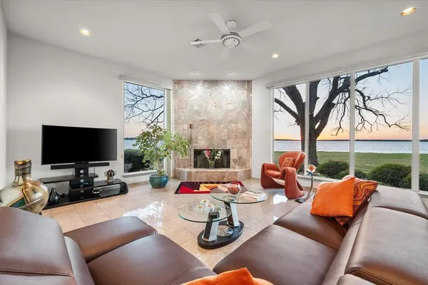 a large white kitchen with a large sink and cabinets