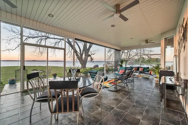 a work room with furniture and a book shelf
