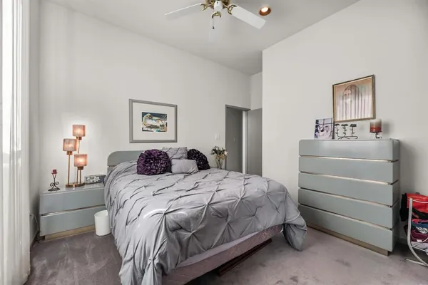 a kitchen with stainless steel appliances granite countertop a sink a stove and a window