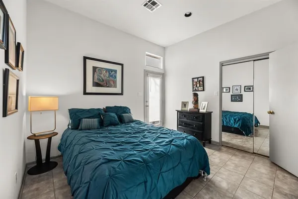 a kitchen with stainless steel appliances kitchen island granite countertop a refrigerator and microwave