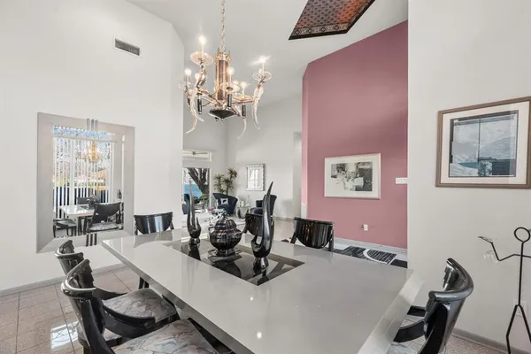 a kitchen with stainless steel appliances granite countertop a sink a stove and a counter space