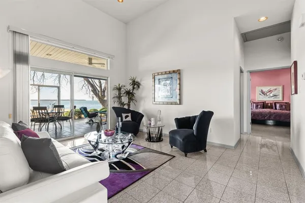 a kitchen with a sink a counter top space appliances and cabinets