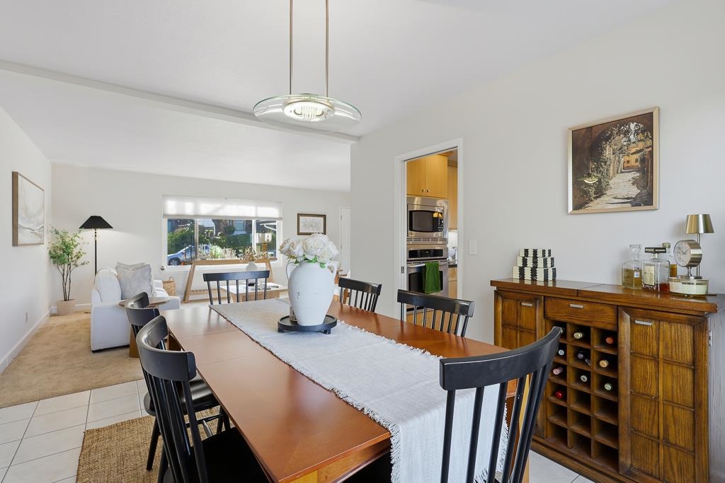 11868 Bloomington Way Dublin, CA 94568 - Photo 13 of 59 a view of a dining room with furniture window and wooden floor