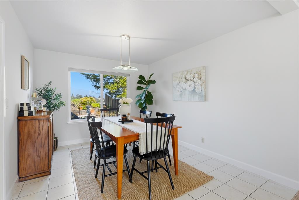 11868 Bloomington Way Dublin, CA 94568 - Photo 16 of 59 a view of a dining room with furniture and chandelier