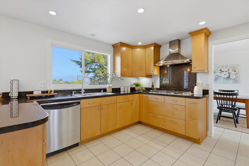 11868 Bloomington Way Dublin, CA 94568 - Photo 18 of 59 a kitchen with stainless steel appliances granite countertop a sink and a stove