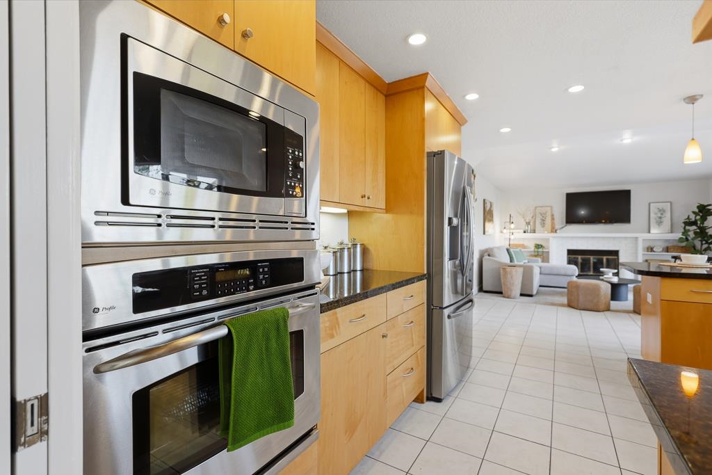 11868 Bloomington Way Dublin, CA 94568 - Photo 19 of 59 a kitchen with sink cabinets and stainless steel appliances
