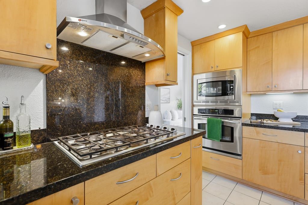11868 Bloomington Way Dublin, CA 94568 - Photo 20 of 59 a kitchen with a stove a sink and a refrigerator