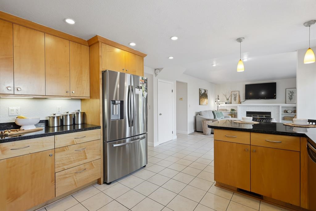 11868 Bloomington Way Dublin, CA 94568 - Photo 21 of 59 a kitchen with granite countertop cabinets and stainless steel appliances