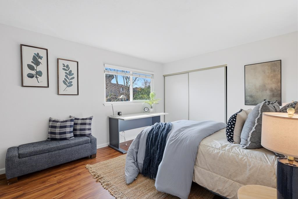 11868 Bloomington Way Dublin, CA 94568 - Photo 33 of 59 a bedroom with a bed and wooden floor