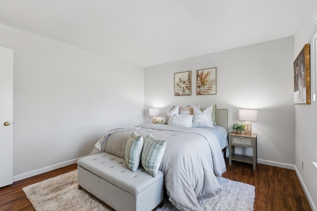 11868 Bloomington Way Dublin, CA 94568 - Photo 41 of 59 a bedroom with a bed and a wooden floor