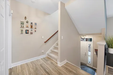 a view of a hallway with front door