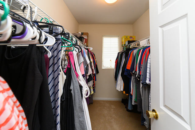 604 Springbrook Trail North Oswego, IL 60543 - Photo 14 of 22 a view of walk in closet with clothes
