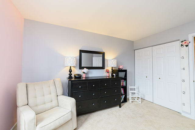 604 Springbrook Trail North Oswego, IL 60543 - Photo 18 of 22 a living room with furniture and a mirror