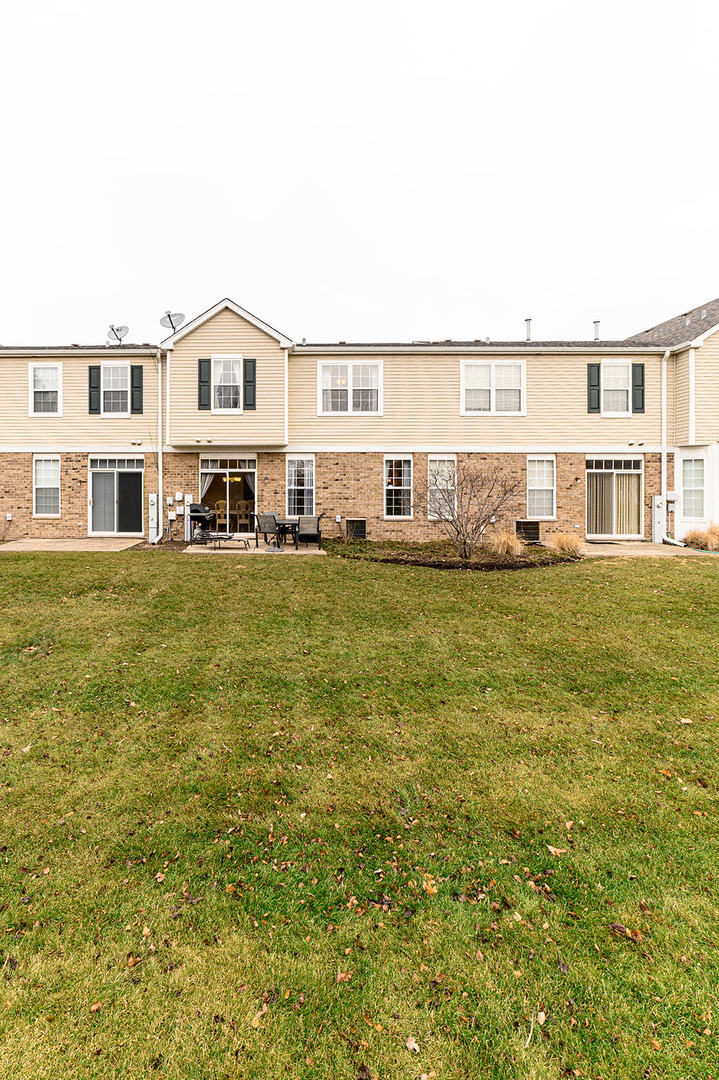 604 Springbrook Trail North Oswego, IL 60543 - Photo 22 of 22 a view of a house with a big yard