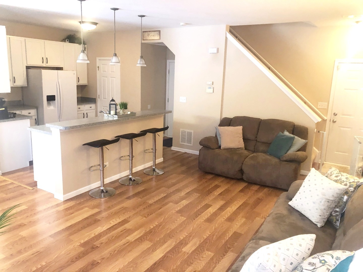 604 Springbrook Trail North Oswego, IL 60543 - Photo 6 of 22 a living room with furniture and a large mirror