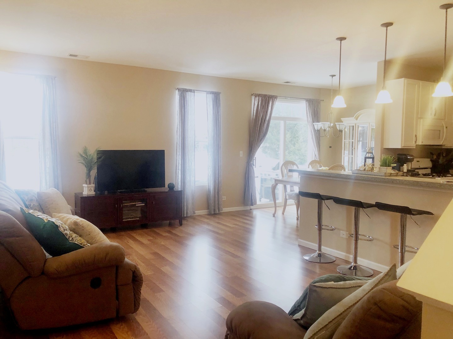 604 Springbrook Trail North Oswego, IL 60543 - Photo 7 of 22 a living room with furniture and a flat screen tv