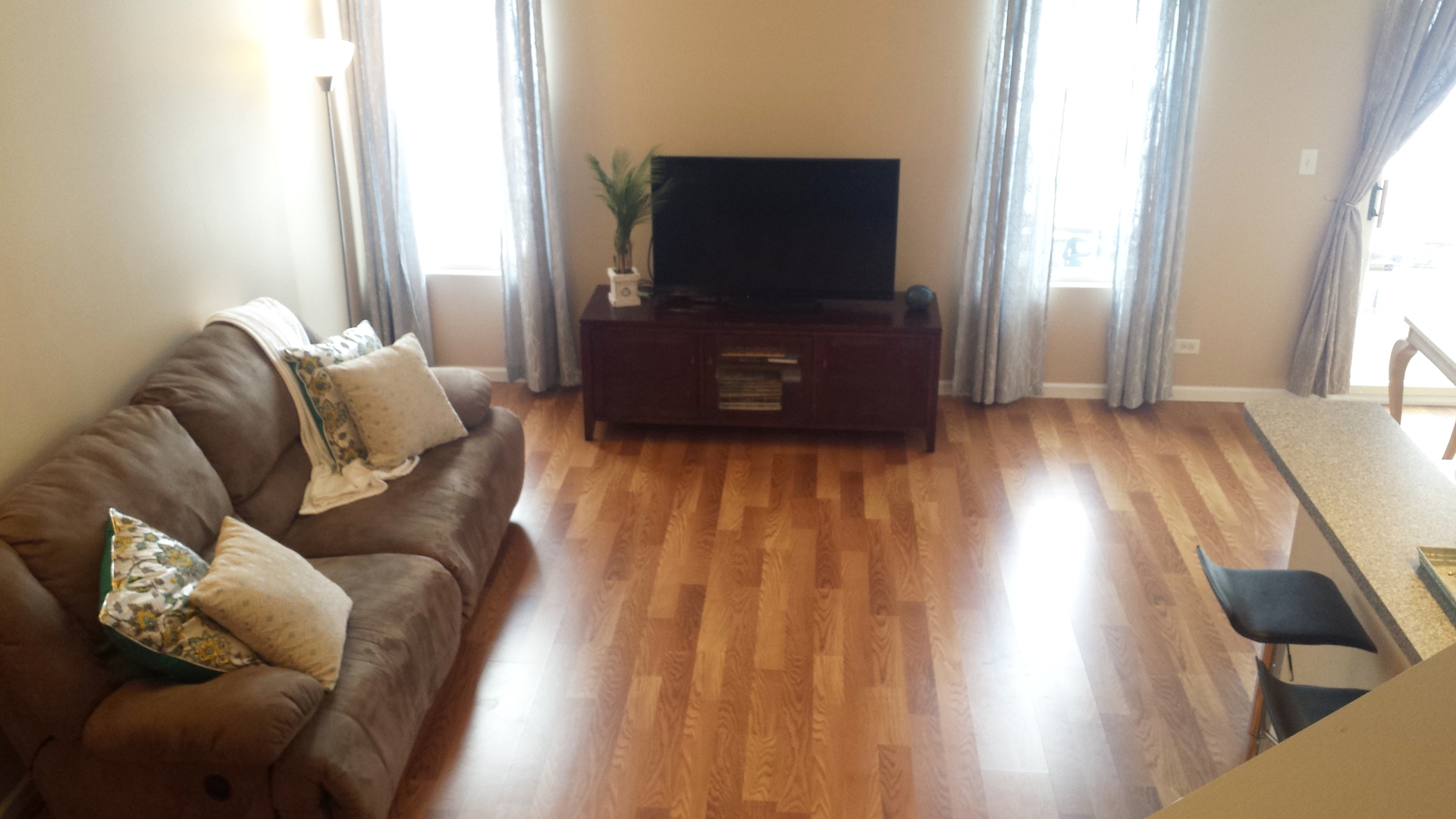 604 Springbrook Trail North Oswego, IL 60543 - Photo 8 of 22 a living room with furniture and a flat screen tv