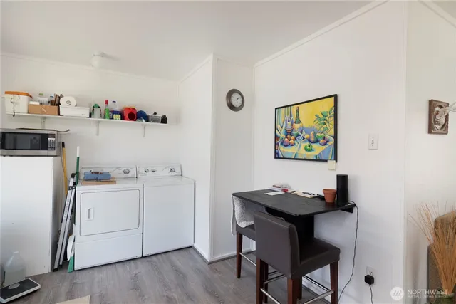 a room with furniture and a refrigerator