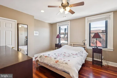 a bedroom with a bed and a table