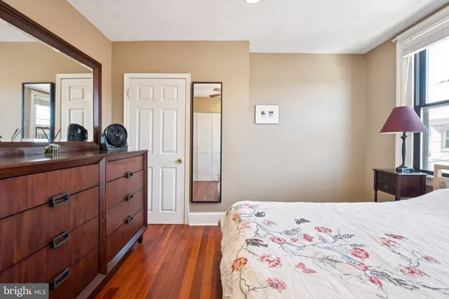 a bedroom with a bed and a dresser