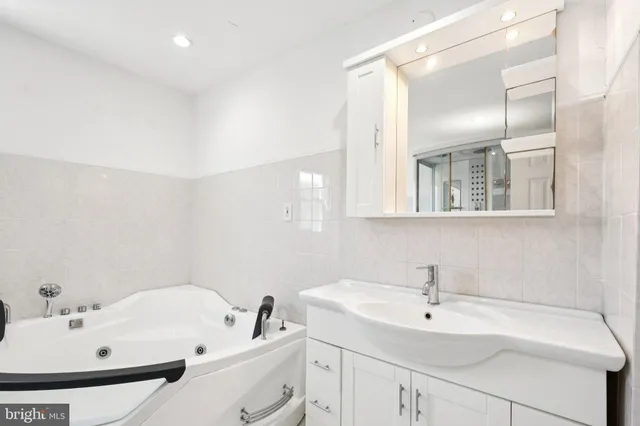 a bathroom with a sink and a bathtub