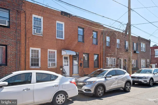 a view of a car parked in front of a building