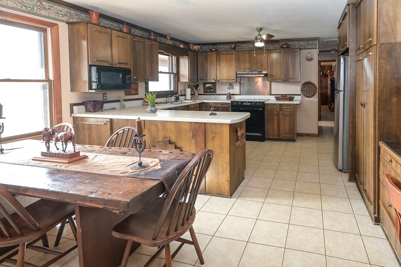 429 Hicks Cut Road Pulaski, TN 38478 - Photo 26 of 70 a kitchen with stainless steel appliances kitchen island granite countertop a sink and cabinets