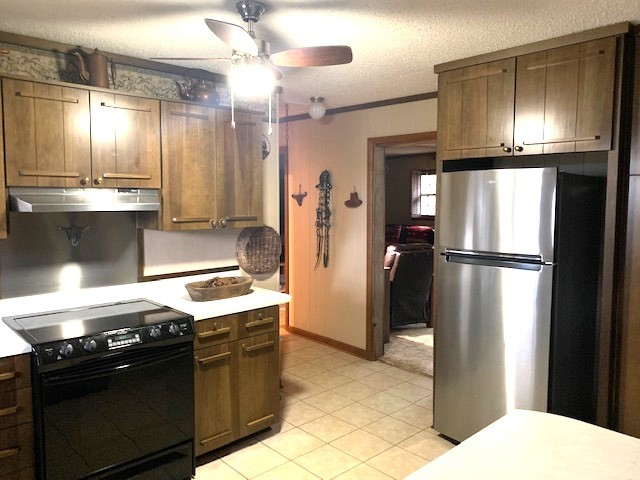 429 Hicks Cut Road Pulaski, TN 38478 - Photo 30 of 70 a kitchen with stainless steel appliances granite countertop a refrigerator a stove and a sink
