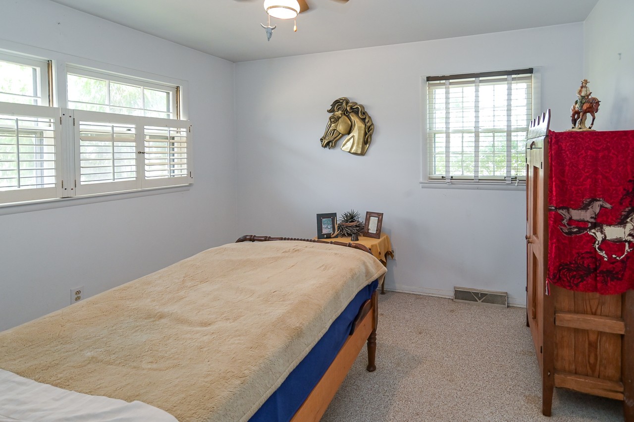 429 Hicks Cut Road Pulaski, TN 38478 - Photo 44 of 70 a bed sitting in a bedroom next to a window