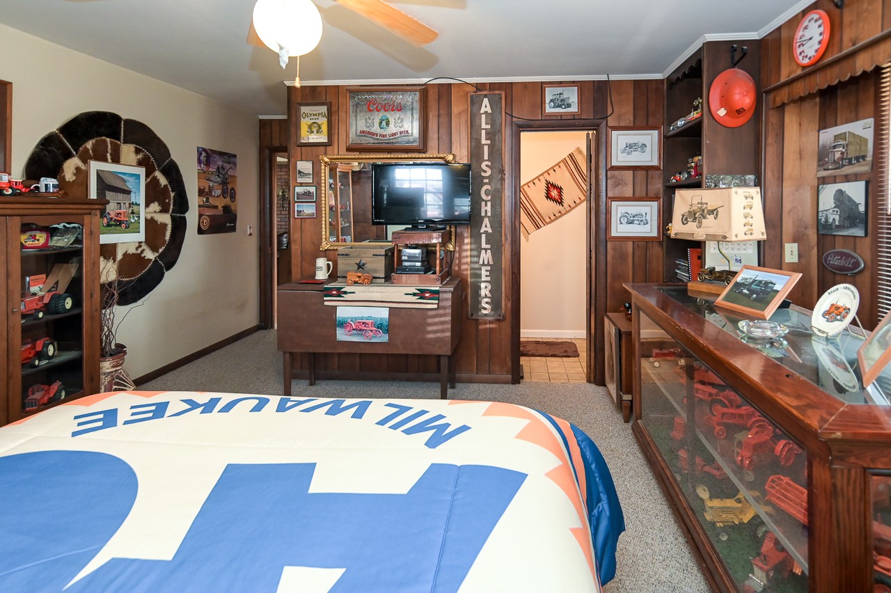 429 Hicks Cut Road Pulaski, TN 38478 - Photo 50 of 70 a bed room with a bed a flat screen tv and dresser