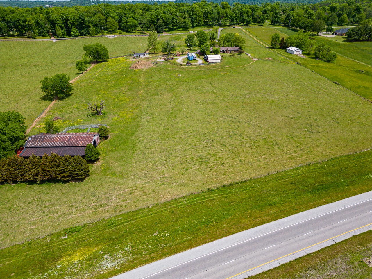 429 Hicks Cut Road Pulaski, TN 38478 - Photo 61 of 70 a view of a lake with lawn chairs and large trees
