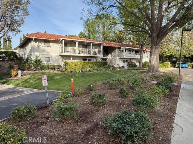 2153 Ronda Granada, Unit A Laguna Woods, CA 92637 - Photo 2 of 2 TREE LINED STREET