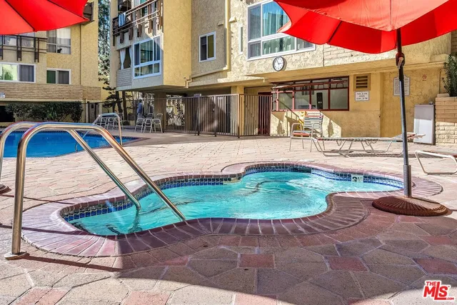 a view of a backyard with sitting area