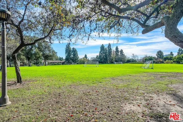a view of a golf course with a big yard
