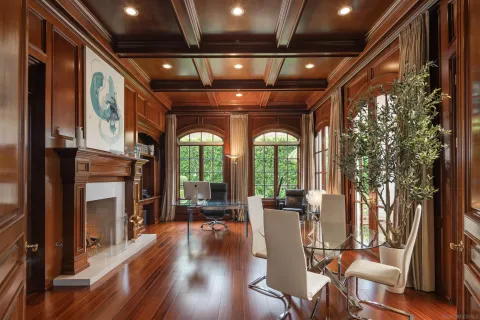 a view of a porch with furniture and a fireplace