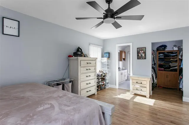 a bedroom with a bed and a cabinets