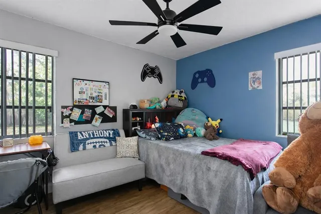 a bedroom with bed and a window