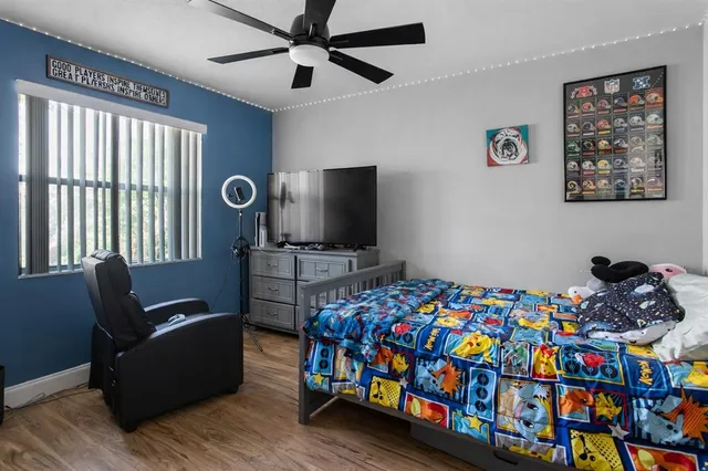 a bedroom with a bed and a tv in it