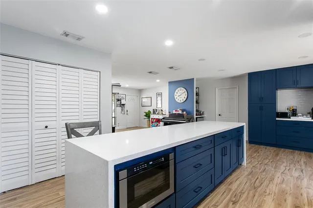 a kitchen with a stove and a sink