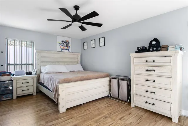 a bedroom with a bed and a dresser