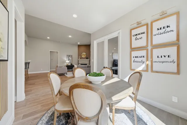 a view of a dining room with furniture window and wooden floor