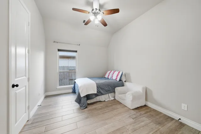 a bed room with a bed and a window